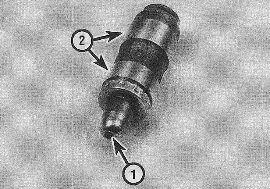 Ford Edge V6 engines_Camshafts and tappets/roller followers and lash adjusters - removal, inspection and installation_On 2.7L engines, inspect the lash adjuster for signs of excessive wear or damage, such as pitting, scoring or signs of overheating (bluing or discoloration) - the areas of wear are the rocker arm pivot point (1) and the side surfaces where the lifter body contacts the cylinder head bore (2)